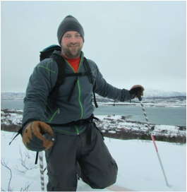 Picture of Dr. Brown, PhD backcountry skiing outside of Tromso, Norway.